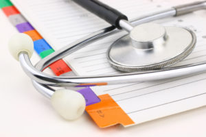 health records and stethoscope
