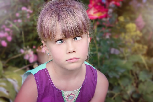 Young girl crossing eyes
